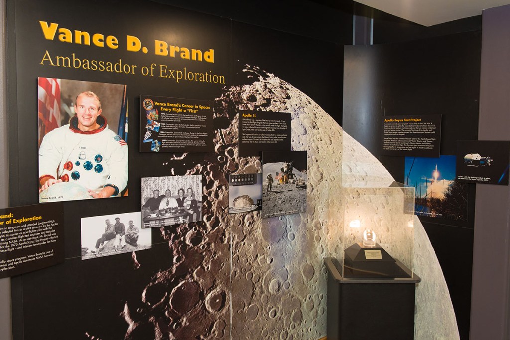 Vance Brand exhibit featuring photos and a moon rock