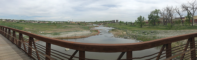 artistic view off pedestrian bridge looking east over St. Vrain Creek