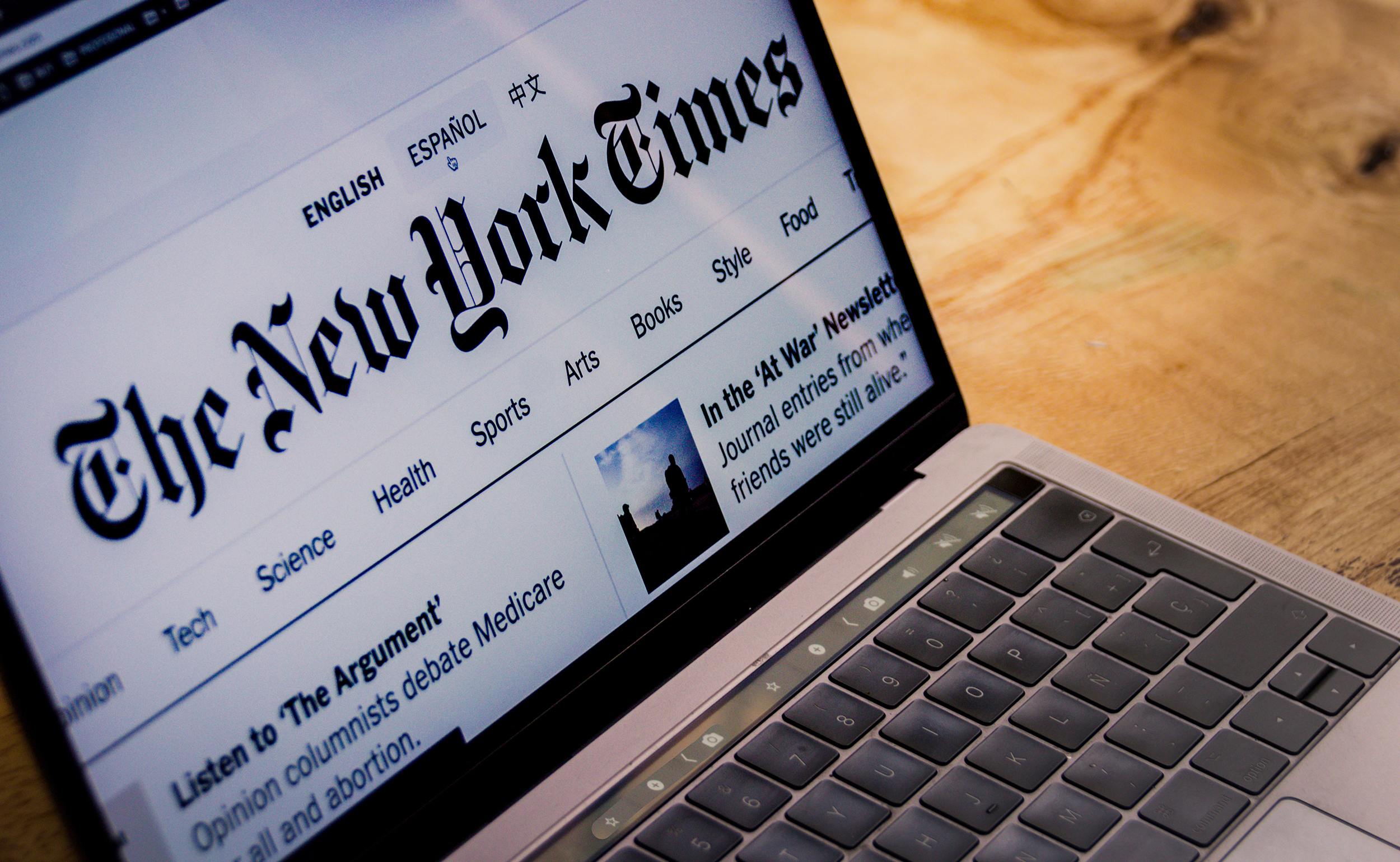 Photograph of The New York Times landing web page displayed on computer screen