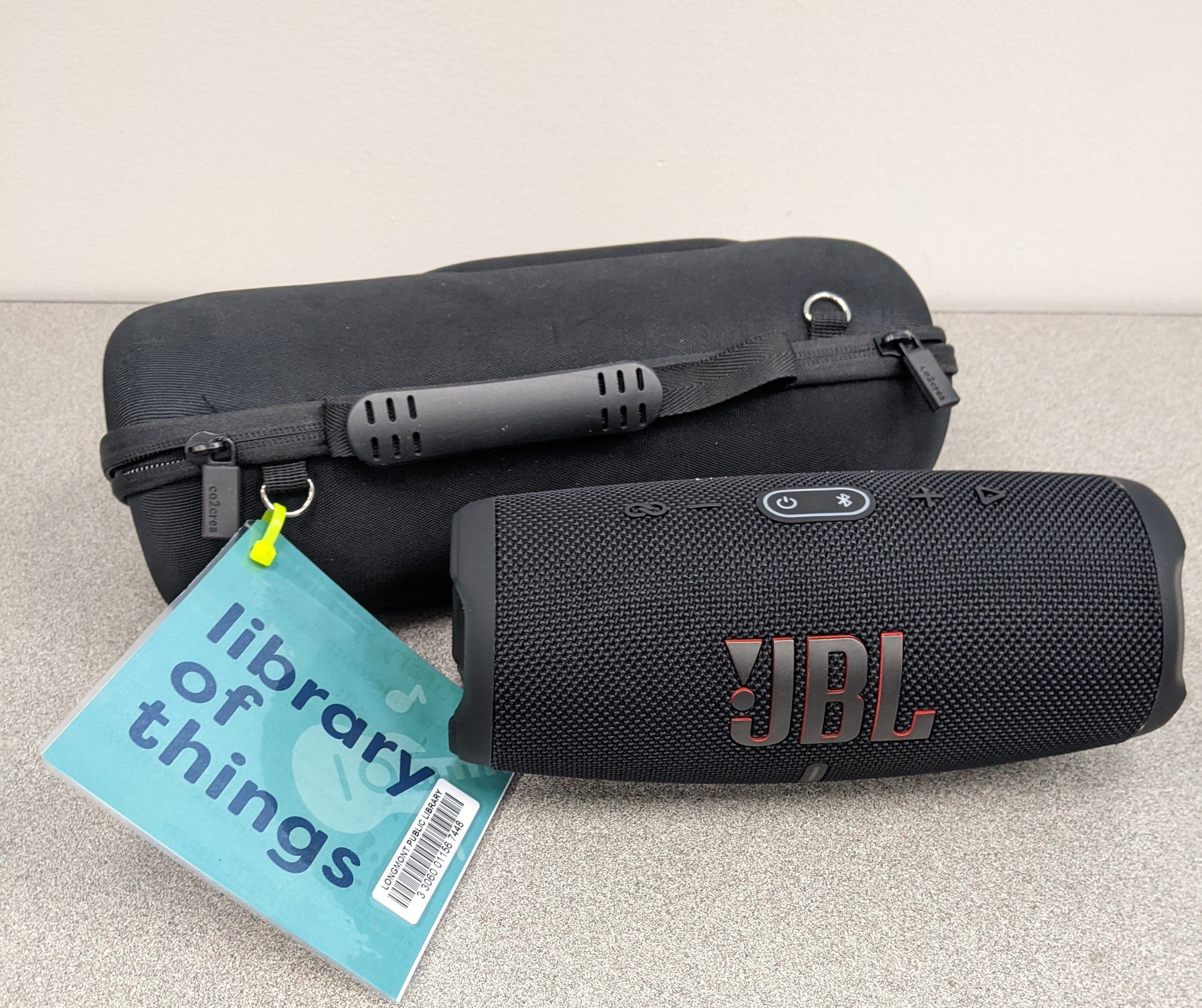 A UBL outdoor bluetooth speaker with carrying case