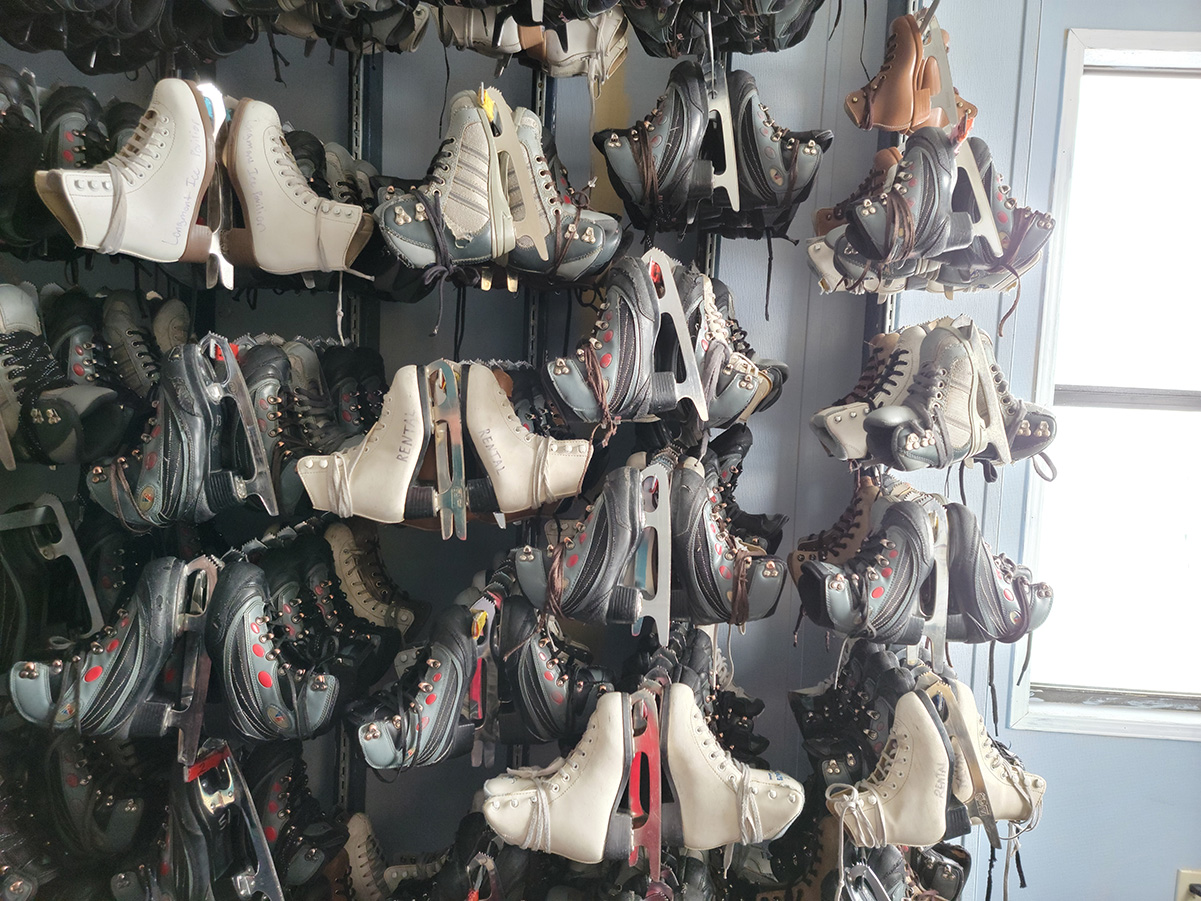 Rental ice skates hanging on the wall