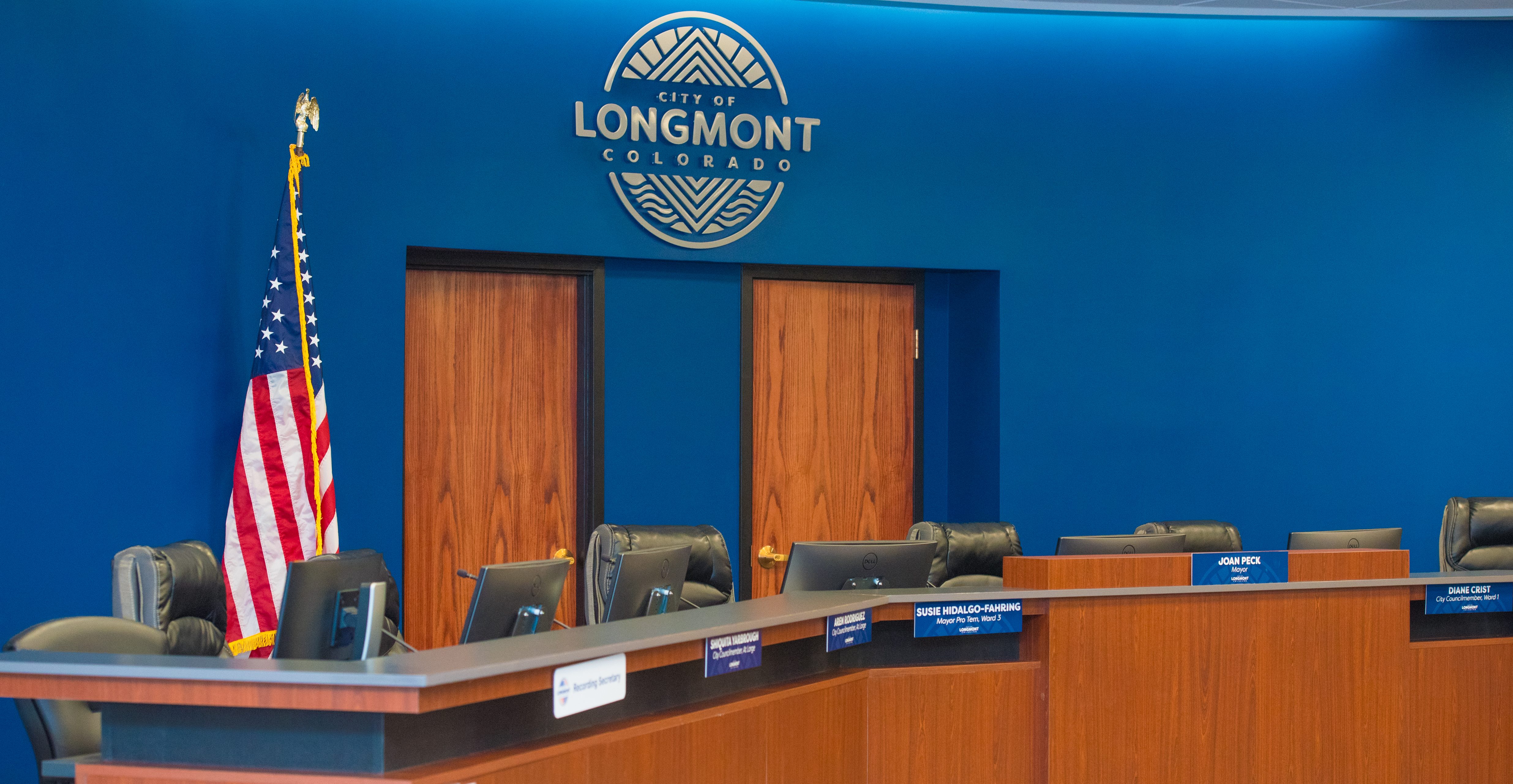 City Council Chambers. Mayor and council desks.