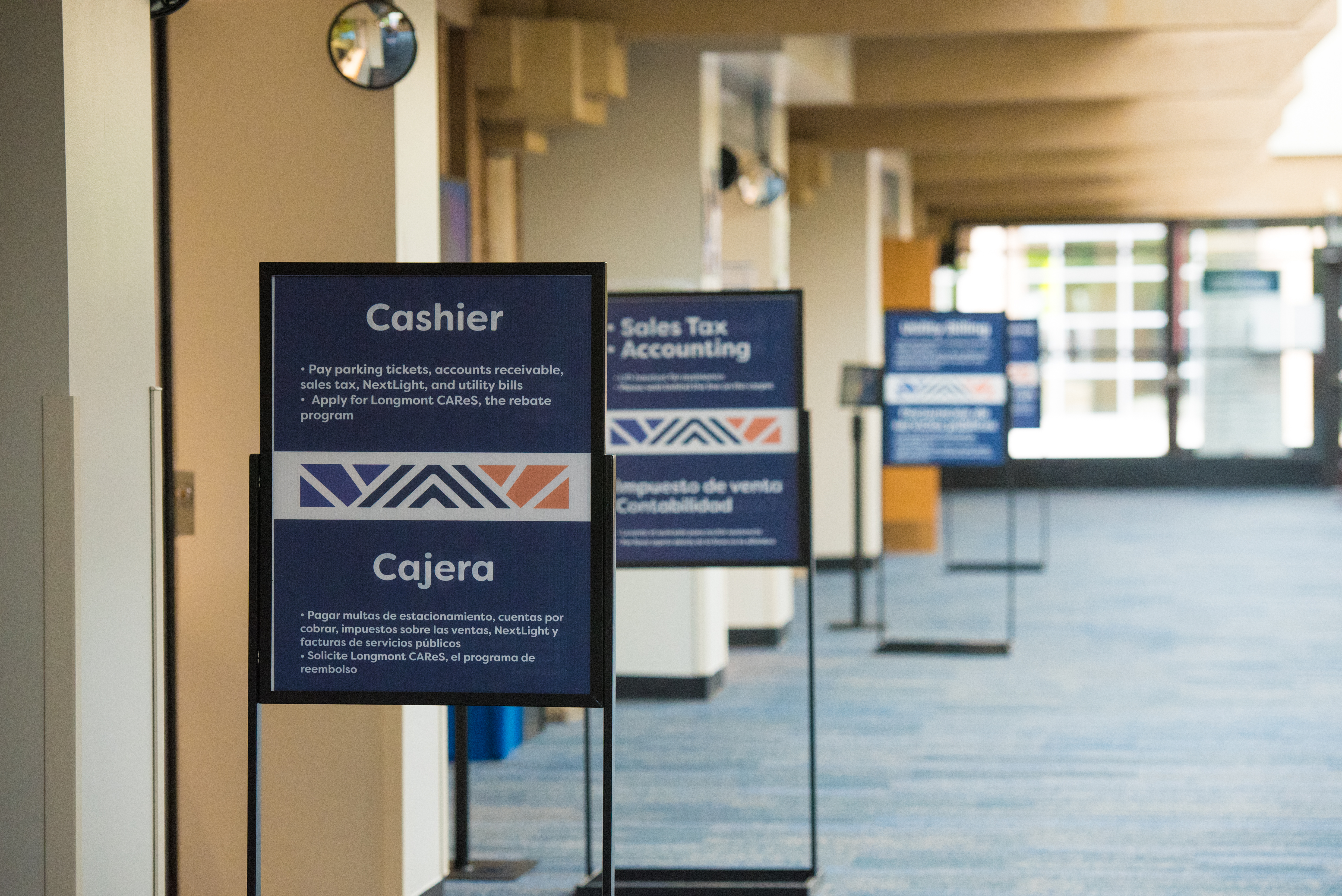 View of the Civic Center mall with signs displaying the many service counters.